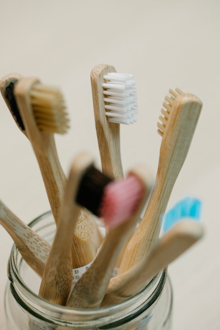 services-03 Sustainable bamboo toothbrushes with colorful bristles for eco-conscious oral hygiene.